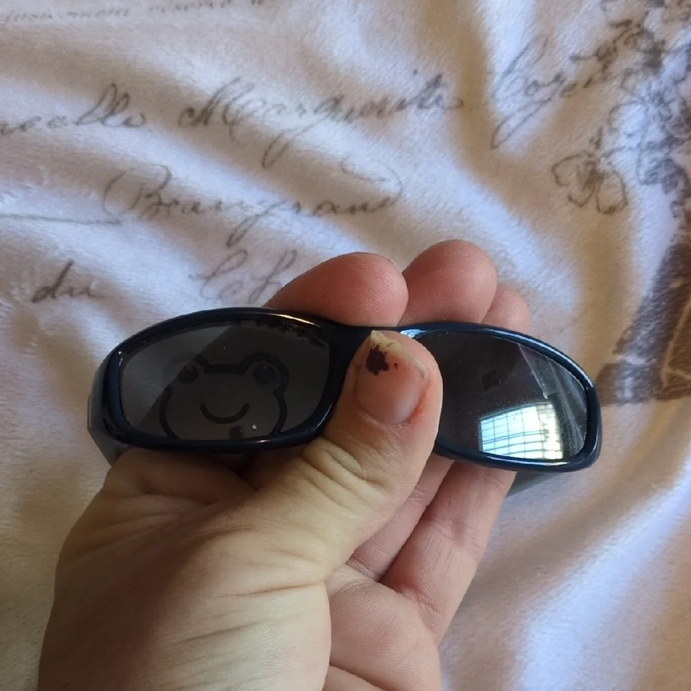 Black And Blue Baby Sunglasses With A Sleek Design Of A Frog On One Of The Lense